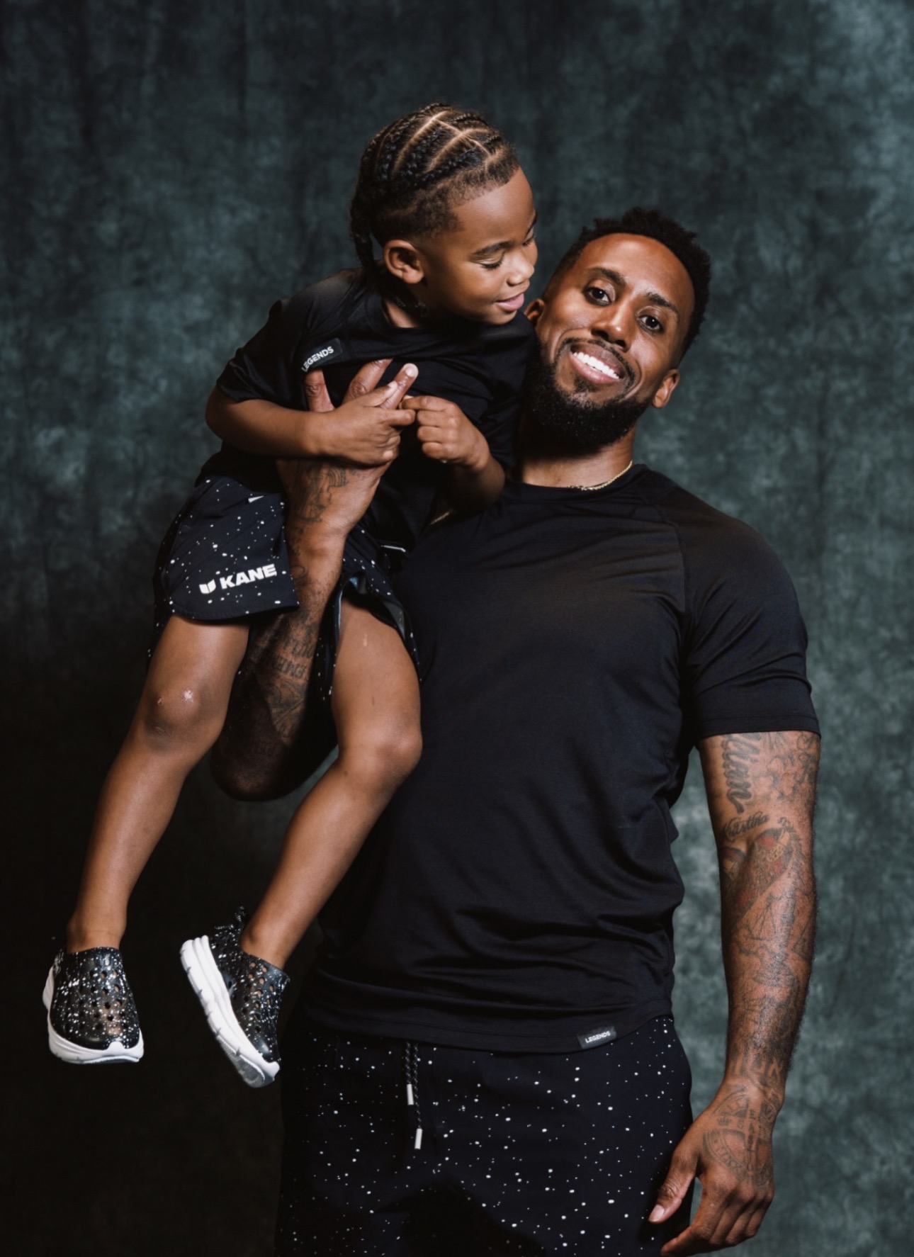 Jeremy Hills holding his son