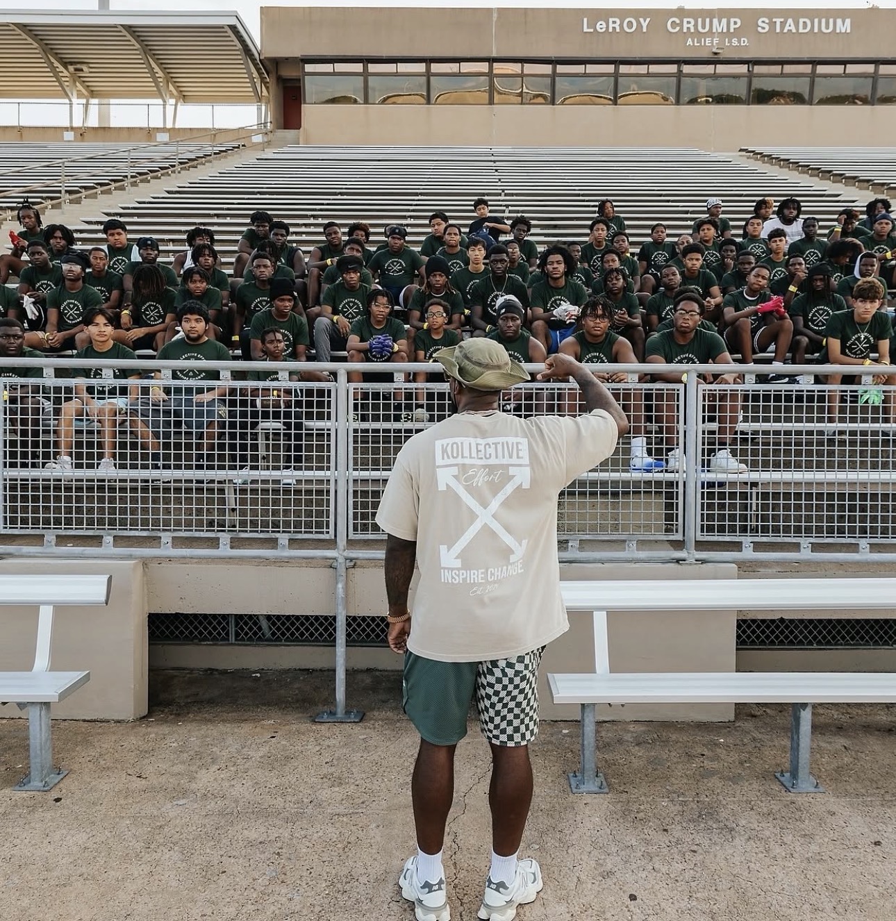 Jeremy Hills addressing a stadium full of young people